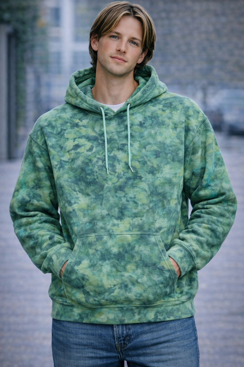 Person wearing a green tie-dye hoodie standing outdoors. Dragons Heart Ice Dye Hoodie, Sweatshirt, Hooded, Adult, Youth, Unisex, XS, S, M, L, XL, 2XL, 3XL, 4XL, 5XL, Dyed in UK, Handmade to order