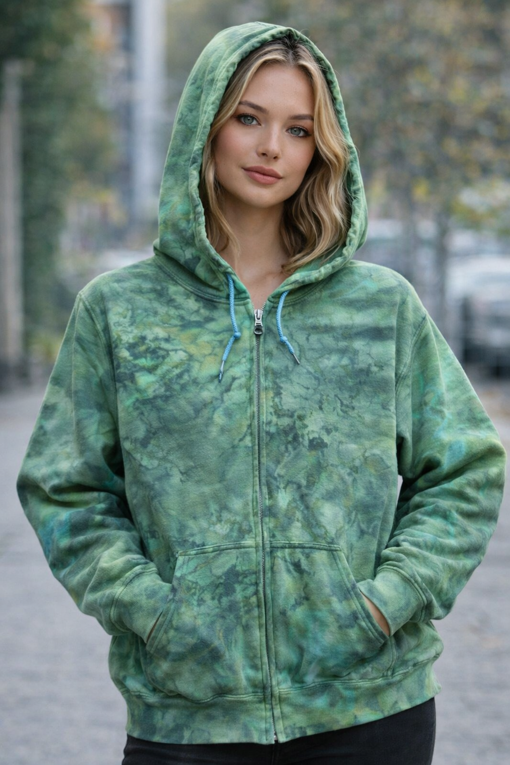 Woman wearing a green tie-dye hoodie outdoors. Dragons Heart Ice Dye Hoodie, Sweatshirt, Hooded, Adult, Youth, Unisex, XS, S, M, L, XL, 2XL, 3XL, 4XL, 5XL, Dyed in UK, Handmade to order