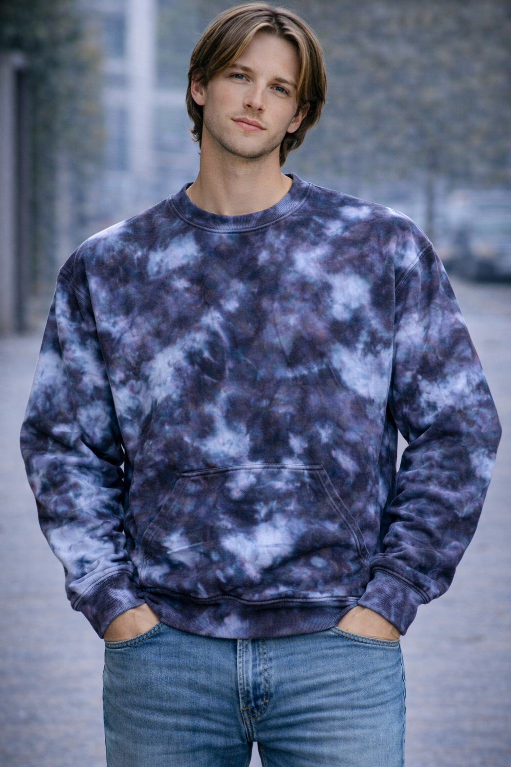 Person wearing a tie-dye sweatshirt and jeans standing outdoors. Snow Maiden Ice Dye Hoodie, Sweatshirt, Zip, Adult, Youth, Unisex, XS, S, M, L, XL, 2XL, 3XL, 4XL, 5XL, Dyed in the UK, Handmade to order