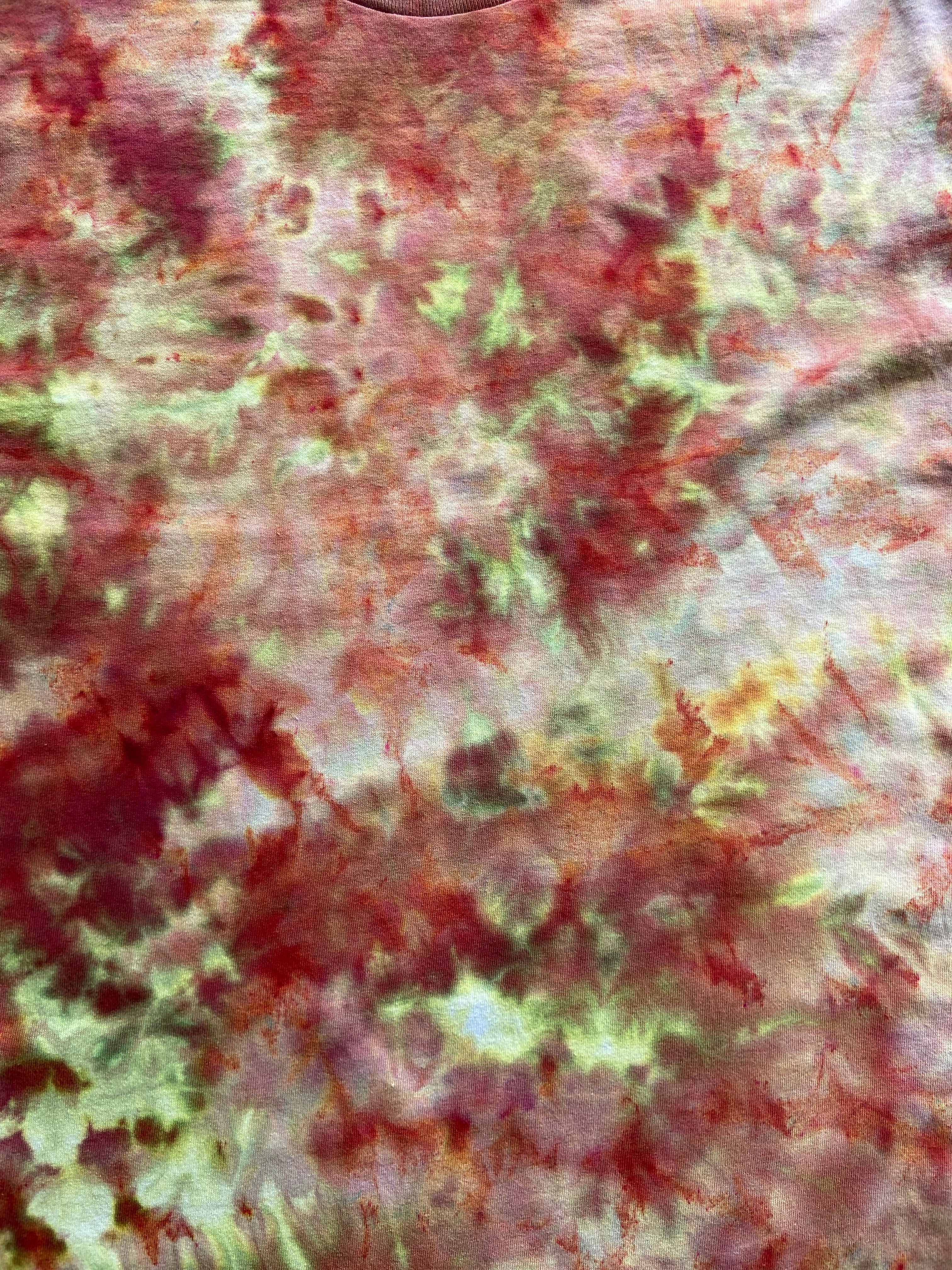 Textured fabric with red, green, and white pattern