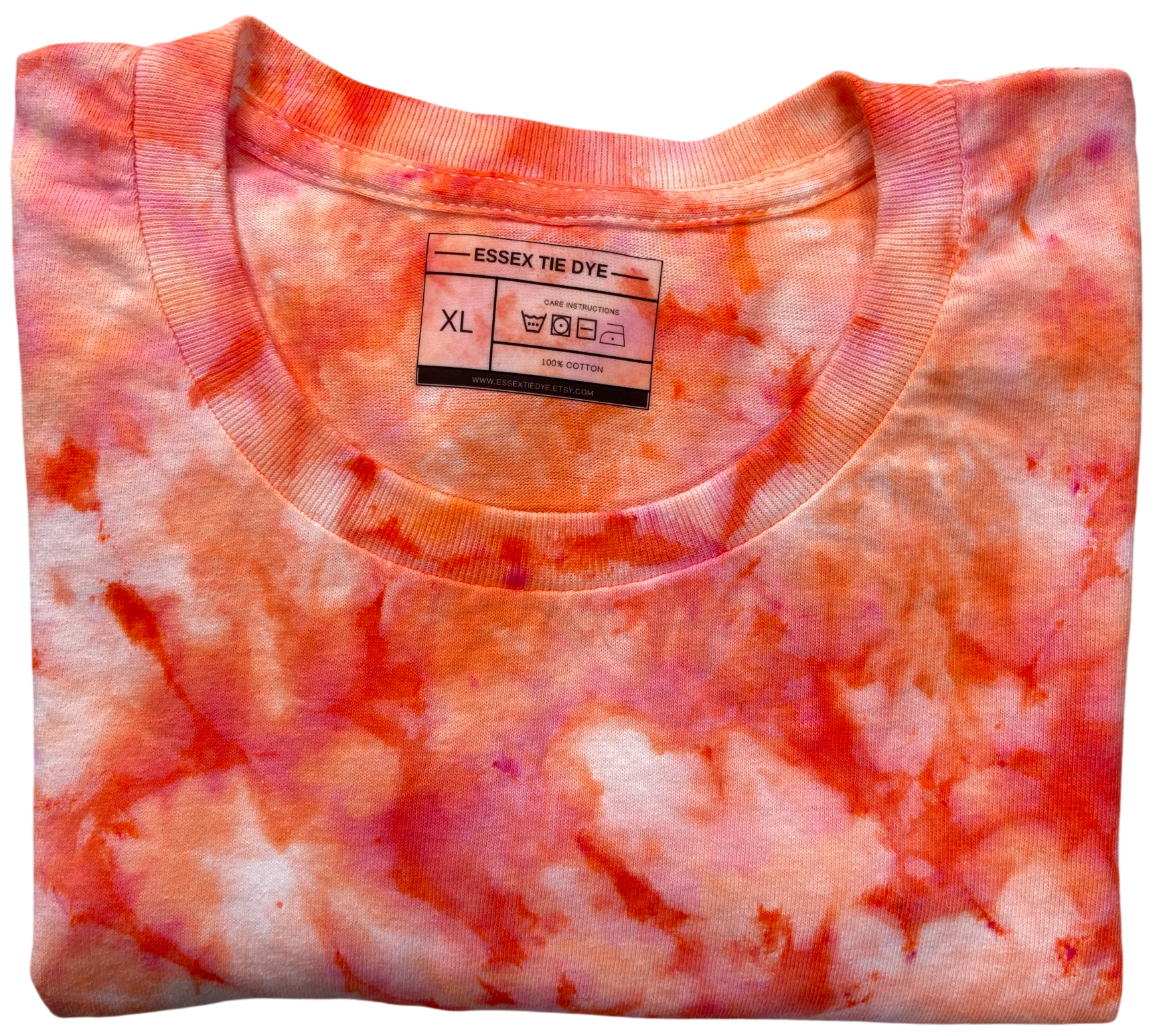 A folded short-sleeve crewneck T-shirt with a vibrant orange and pink tie-dye pattern, featuring an Essex Tie Dye brand label at the collar.