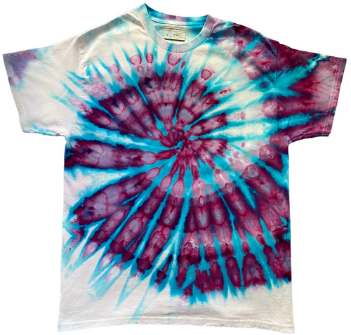 Tie-dye t-shirt with a spiral pattern in blue and purple on a white background