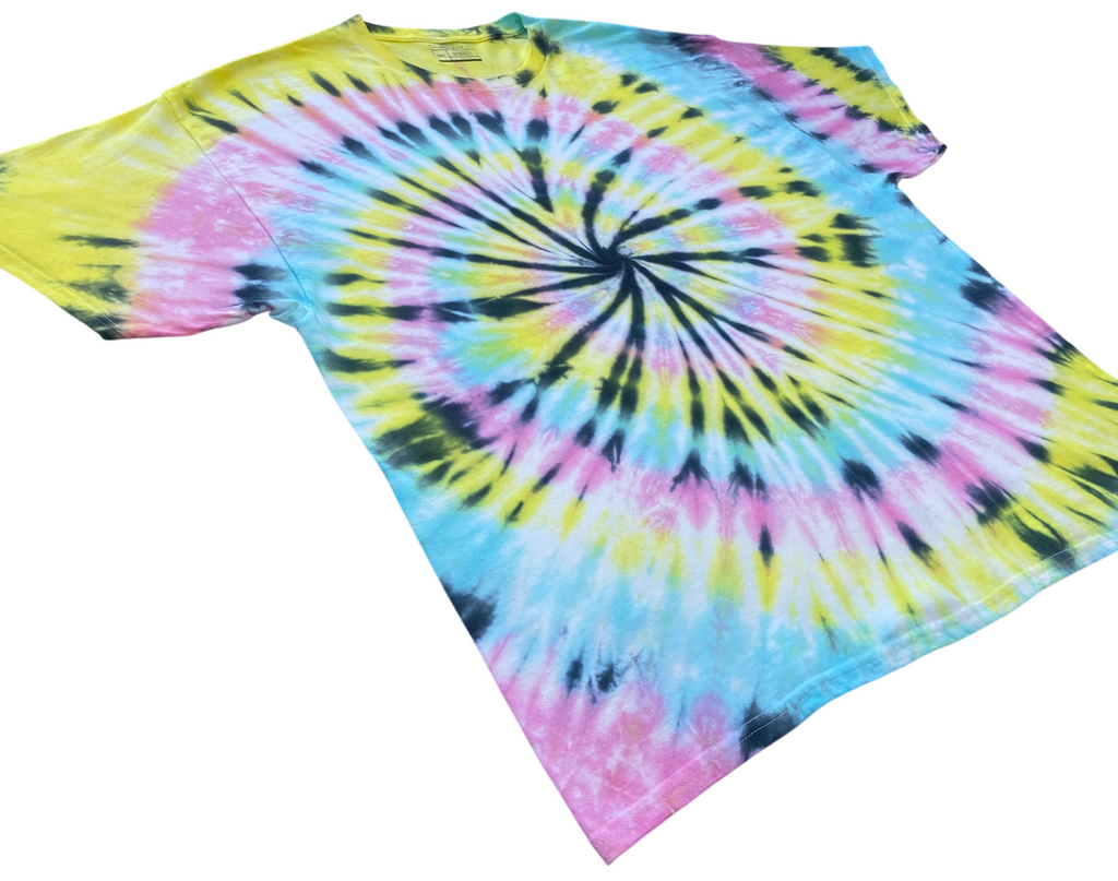Summer pastel spiral tie dye T-shirt in yellow, pink and blue with a bold black spiral pattern, hand dyed in the UK by Essex Tie Dye.