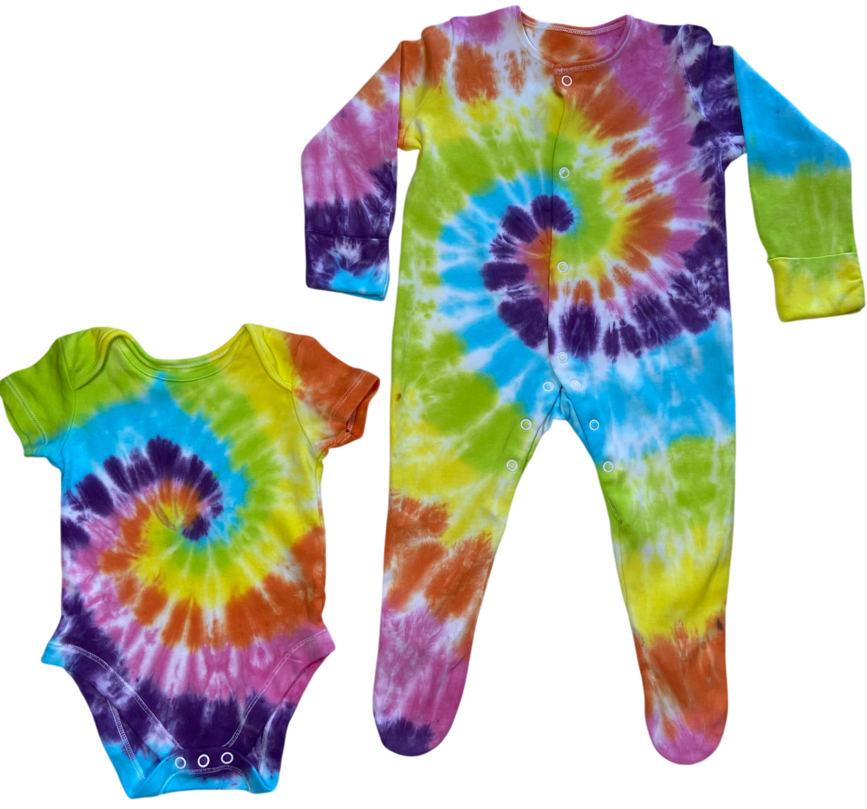 Rainbow spiral tie dye baby vest and sleepsuit in bright blue, green, yellow, orange and purple, hand dyed in the UK by Essex Tie Dye.