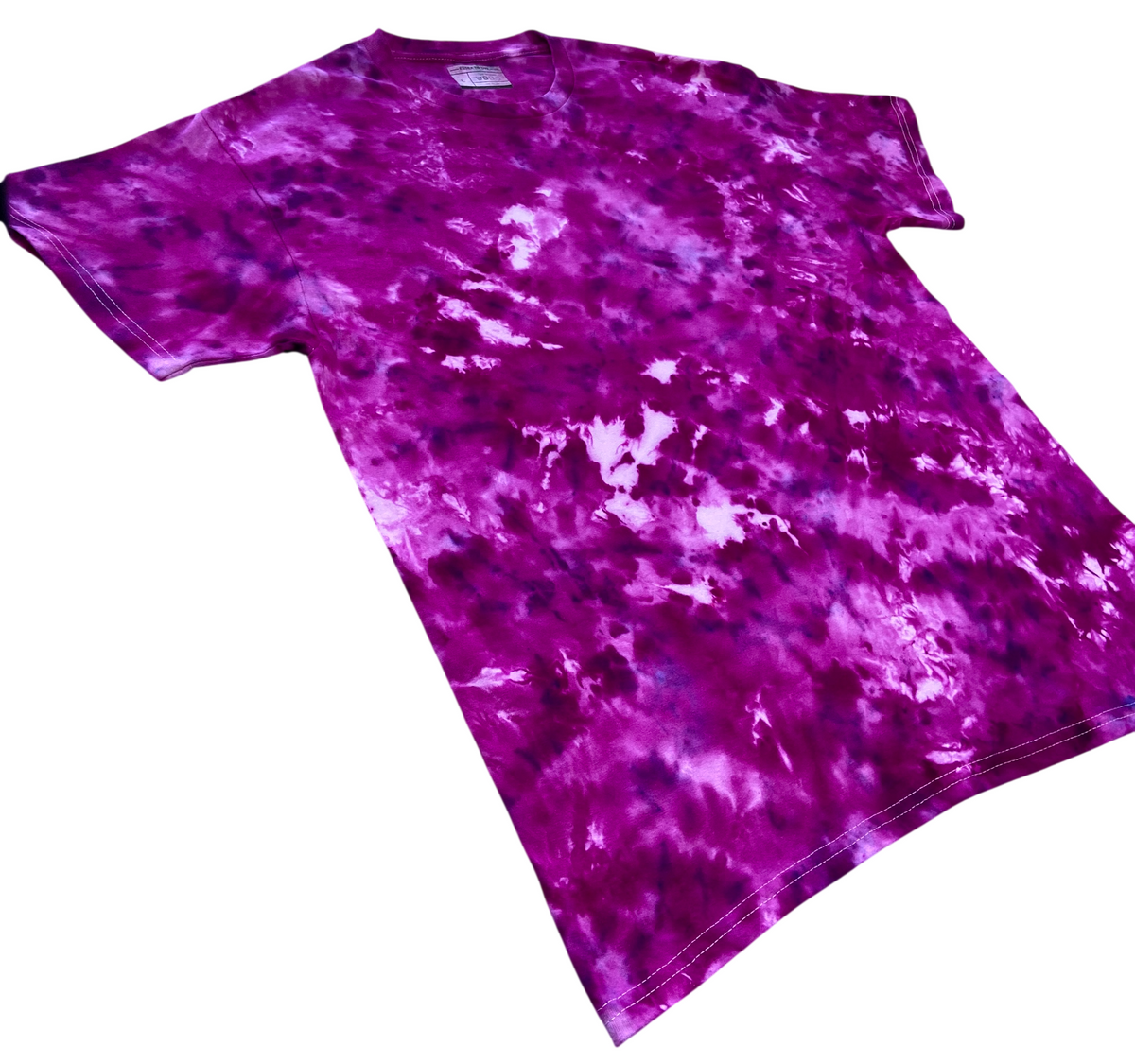 A short-sleeve crewneck t-shirt featuring a vibrant purple and magenta tie-dye pattern with white highlights, shown against a plain white background.