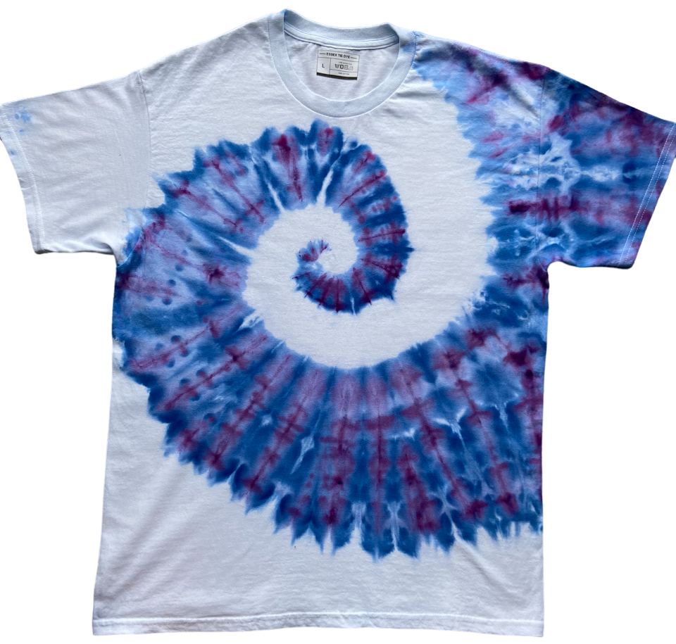 Tie-dye t-shirt with blue and red spiral design on a white background