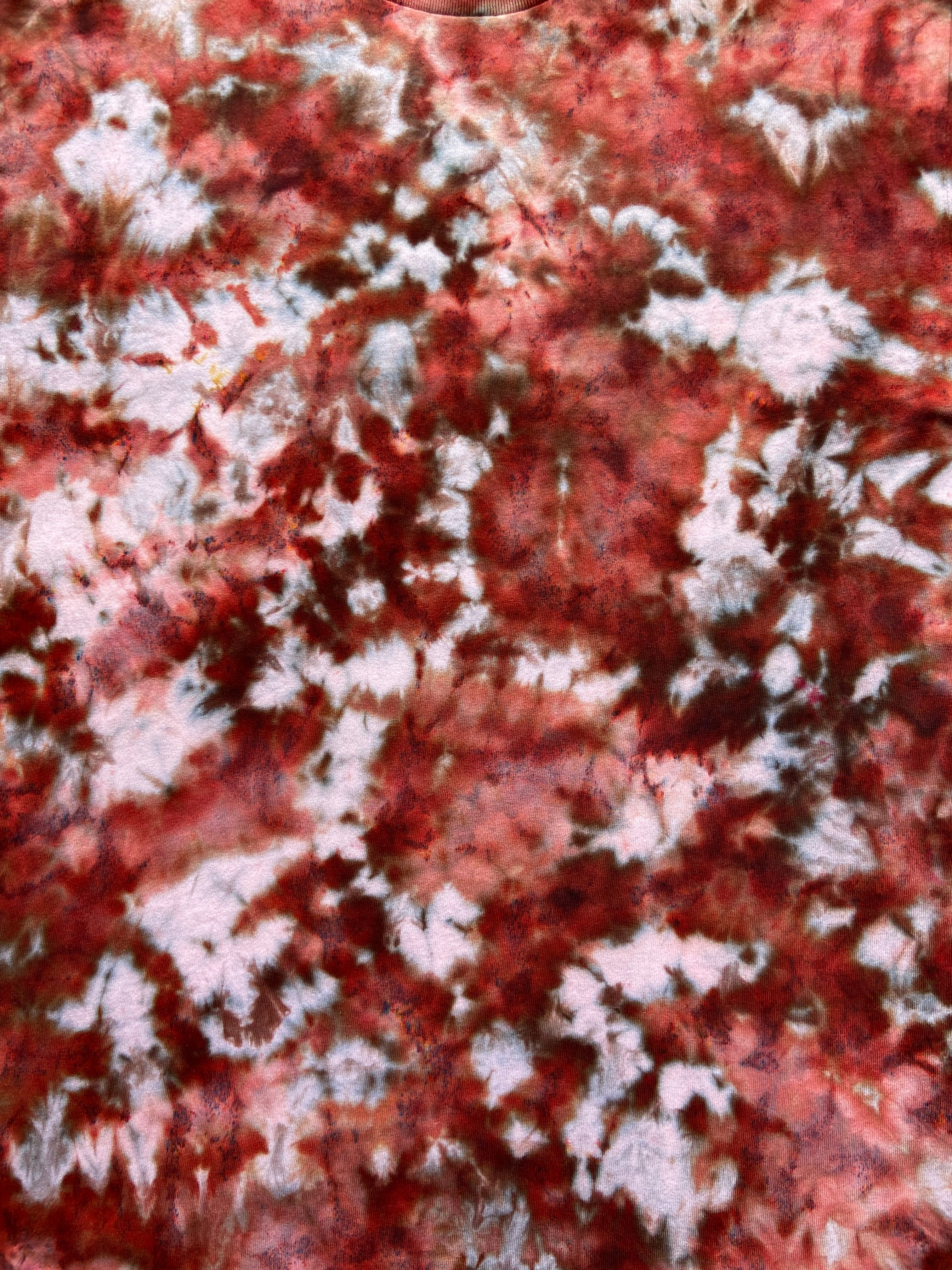 Close-up of a textured surface with red and white patterns