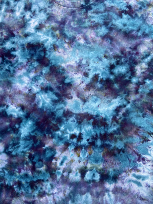 Textured blue and purple surface with a star-like pattern