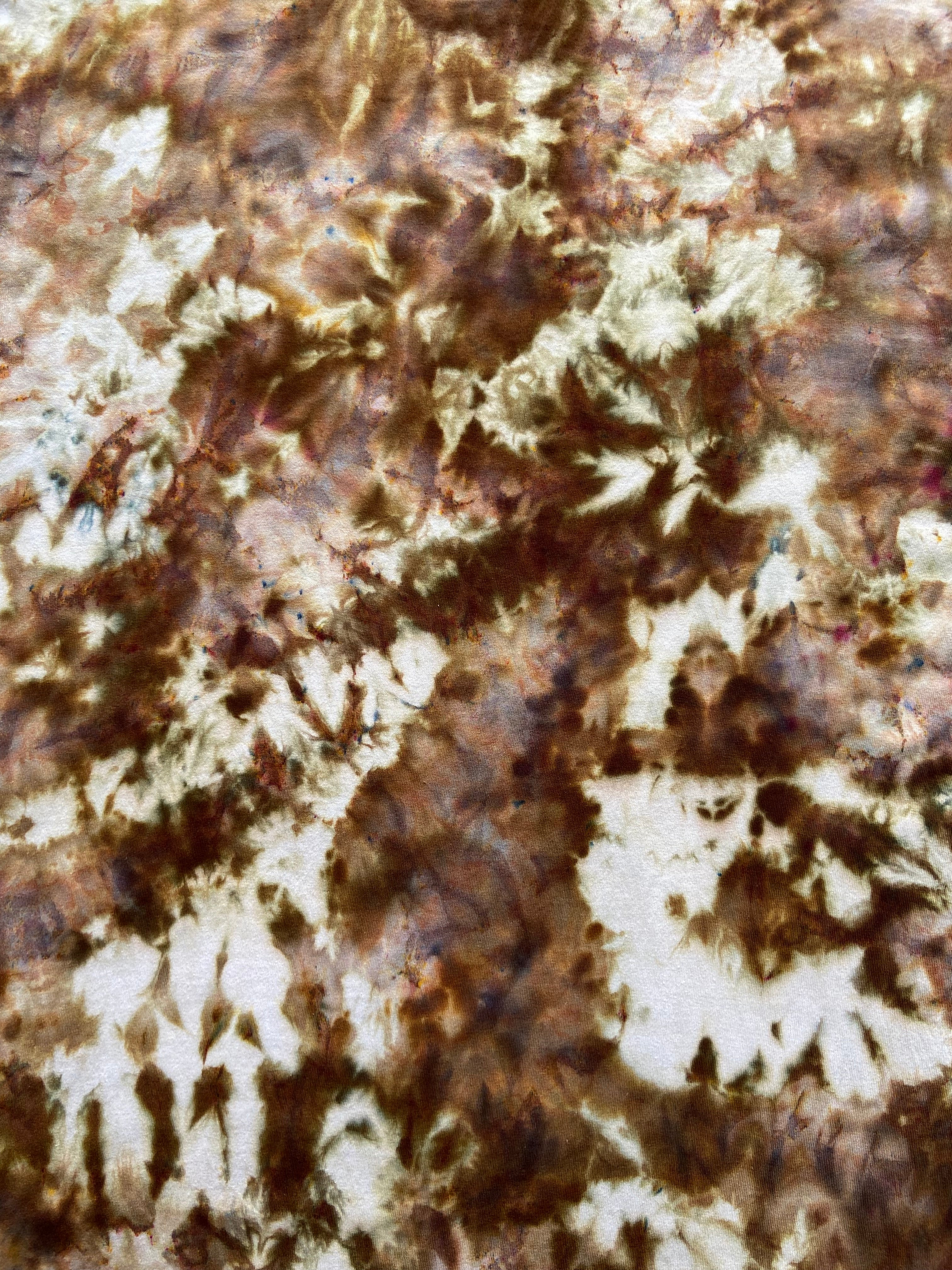 Close-up of a textured surface with brown and white patterns