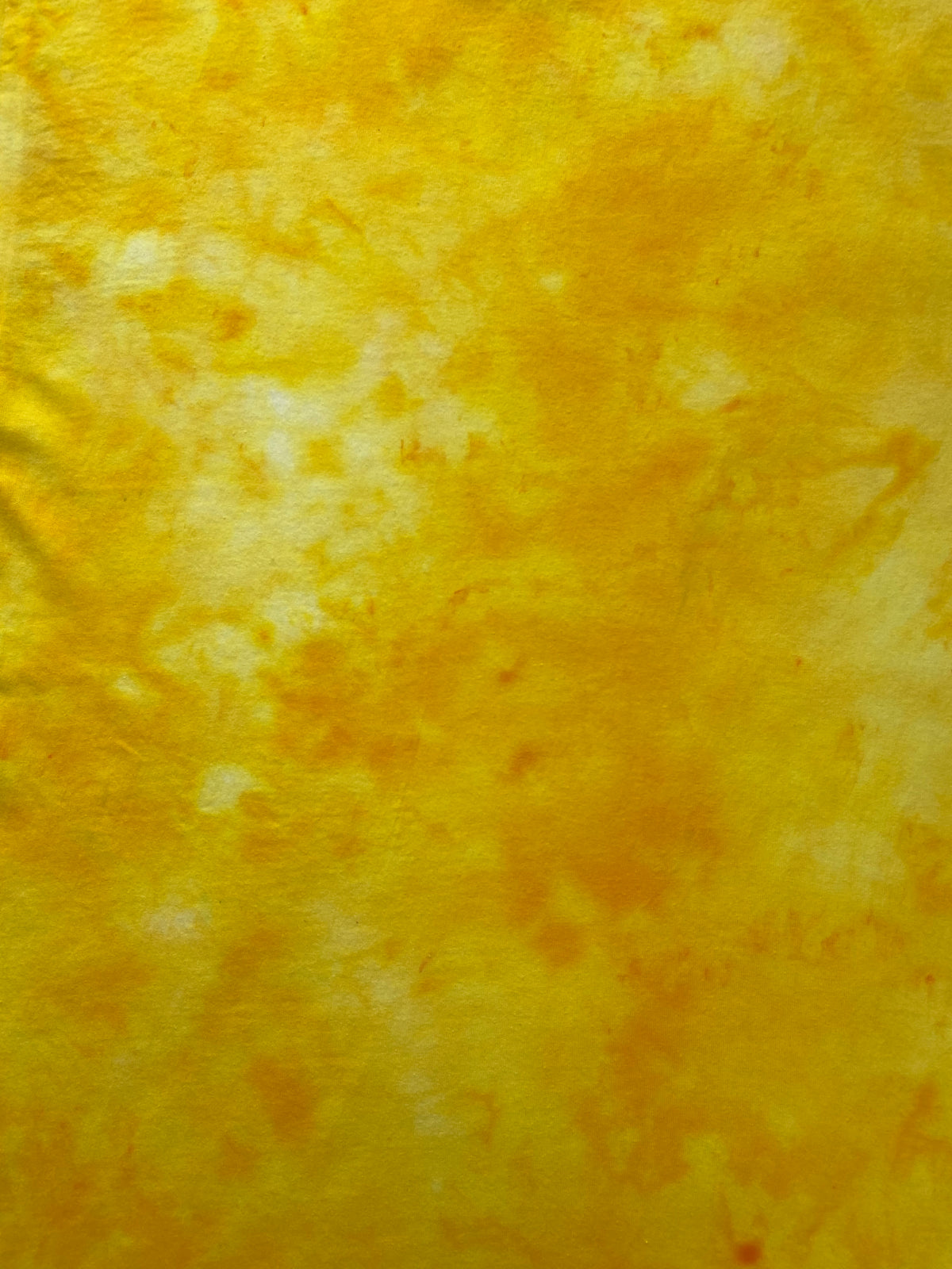 Close-up of the Bright Yellow Ice Scrunch tie dye pattern in vibrant golden yellow and lighter yellow tones, showing the hand dyed fabric detail.