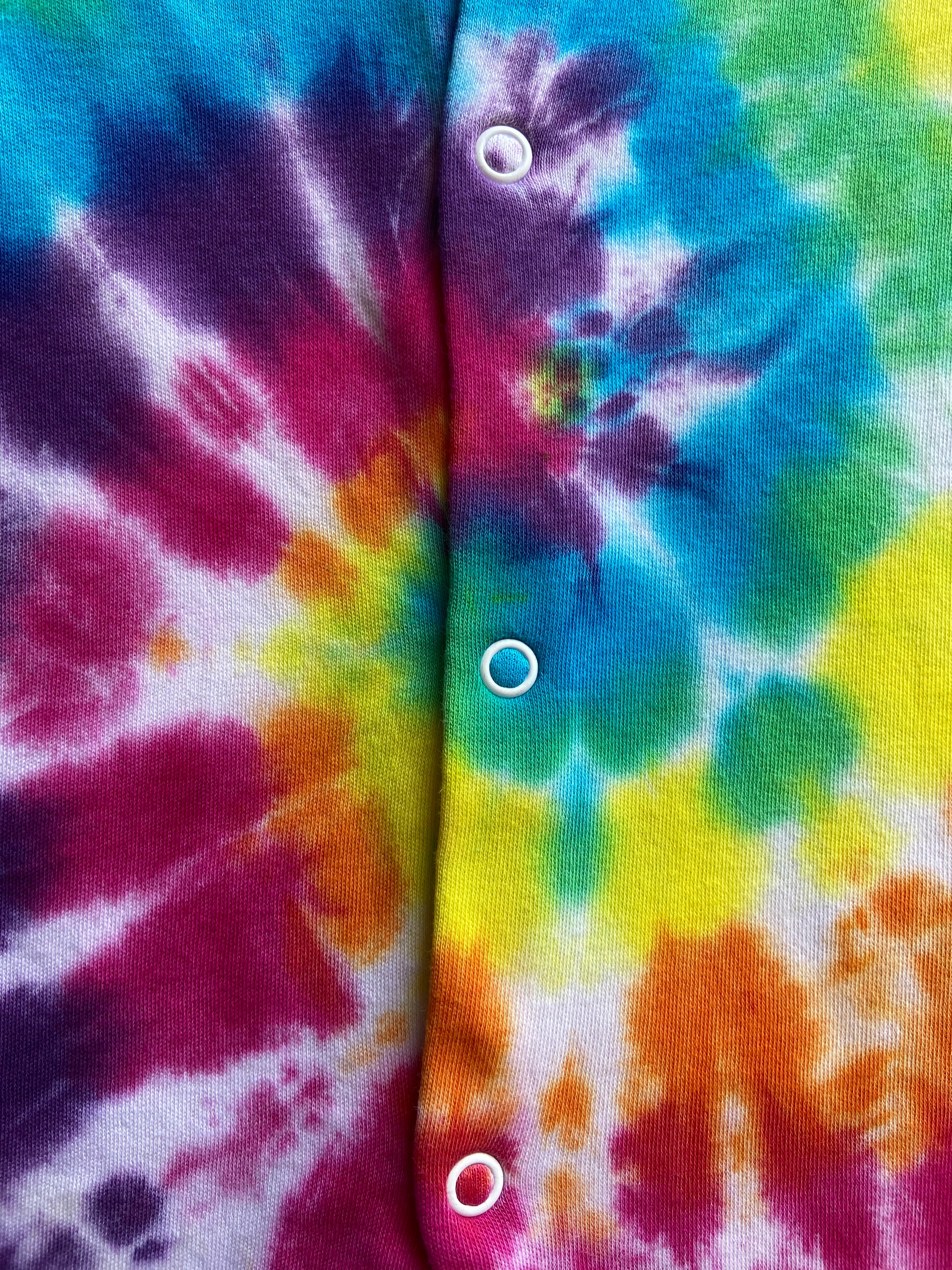 Close-up of a tie-dye fabric with colorful patterns