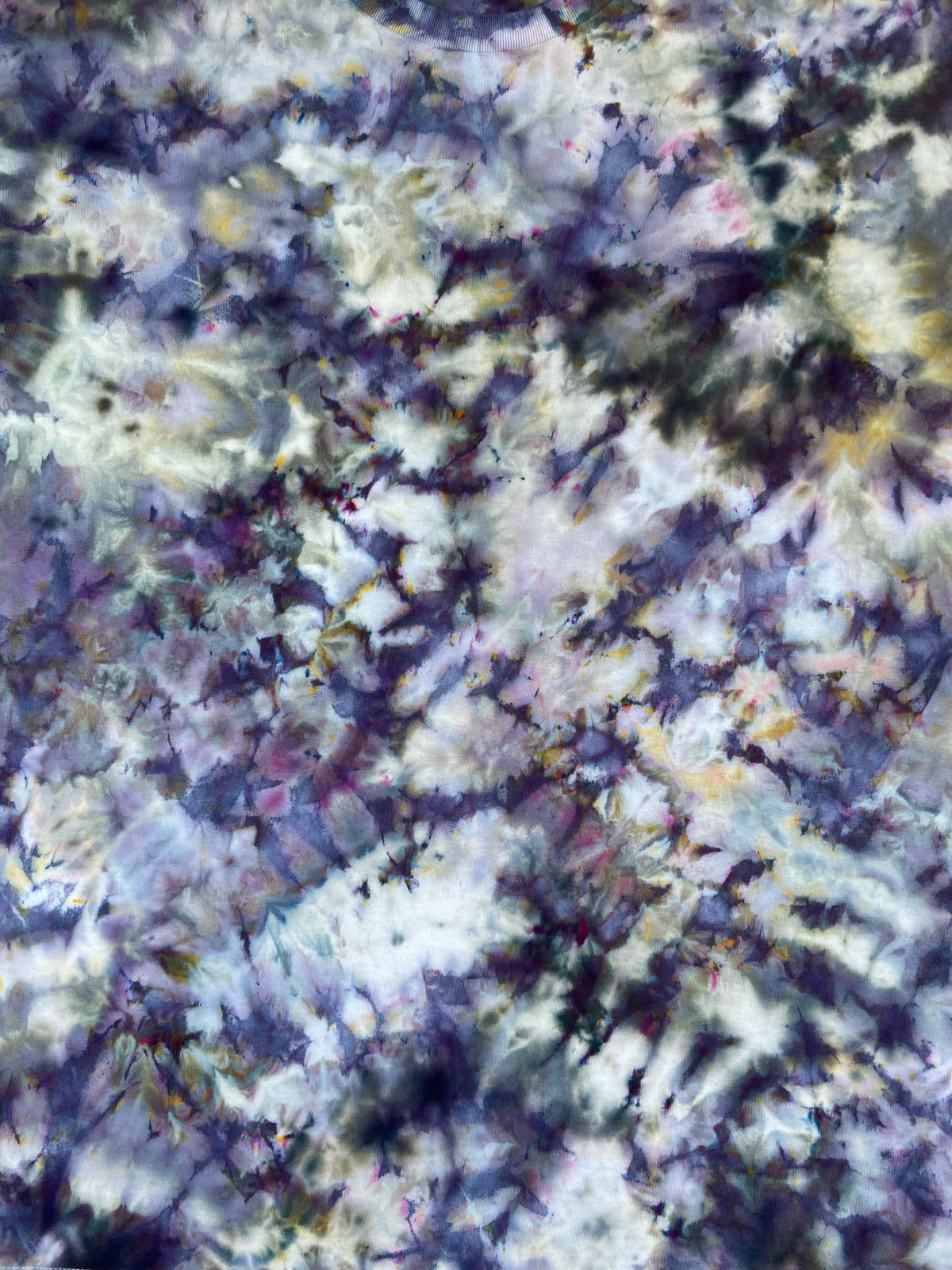 Close-up of the Brushed Steel Ice Scrunch tie-dye T-shirt showing smoky grey, charcoal, purple and soft white marbled tie-dye detail.