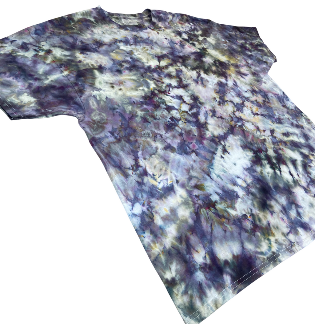 Angled view of the Brushed Steel Ice Scrunch tie-dye T-shirt featuring smoky grey, charcoal, purple and soft white marbled patterns.