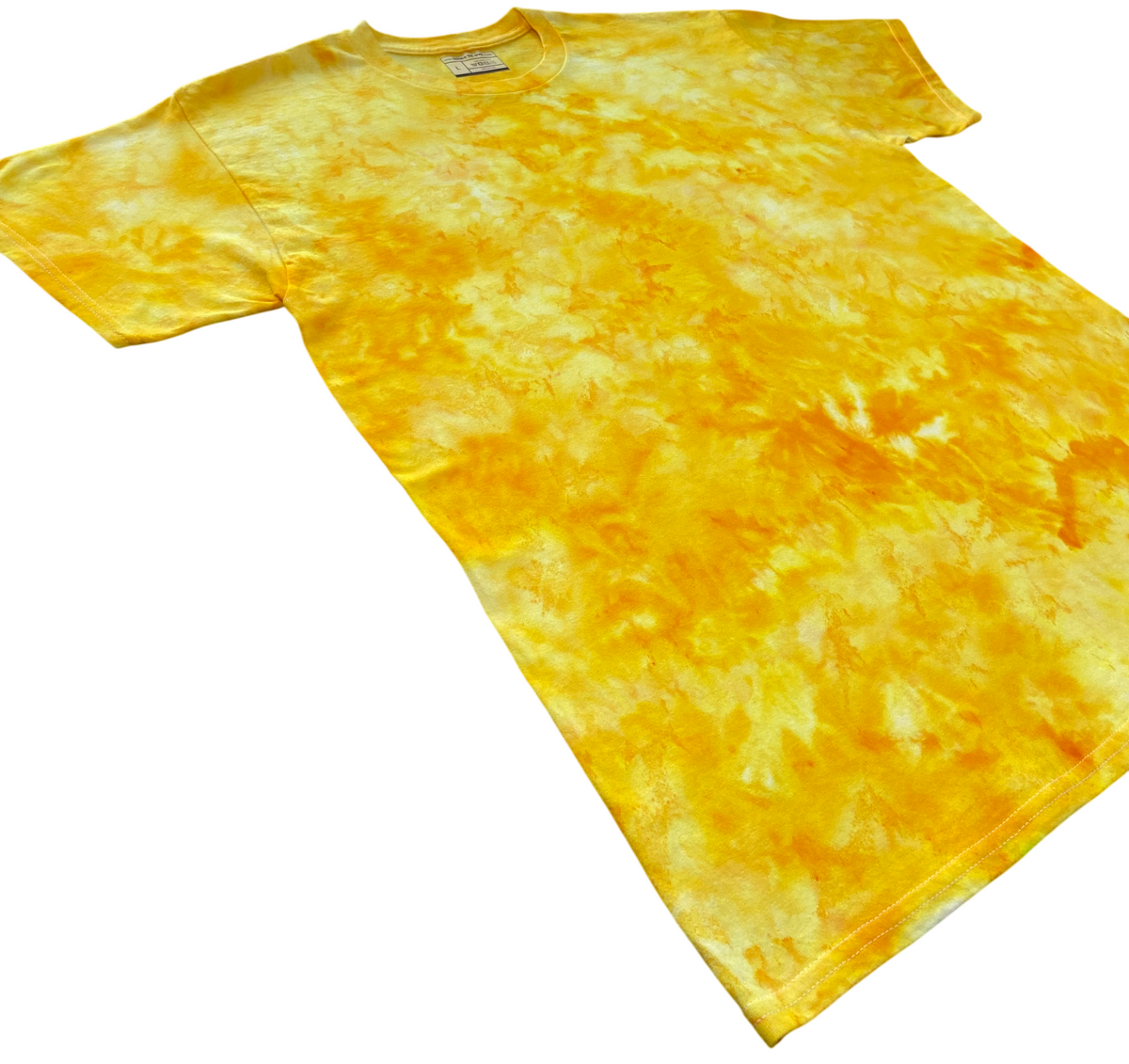 Clear Yellow Ice Scrunch tie-dye T-shirt shown at an angle, featuring clear yellow, golden yellow and soft cream marbled patterns.