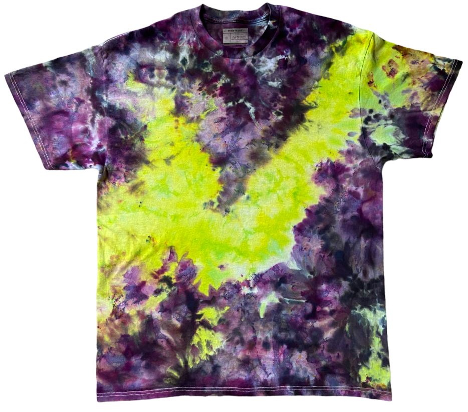 Tie-dye t-shirt with purple and green patterns on a white background