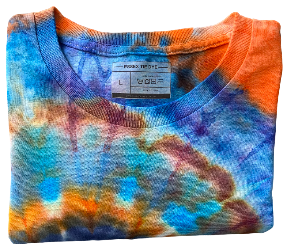 Folded tie-dye shirt with multicolor pattern on a white background
