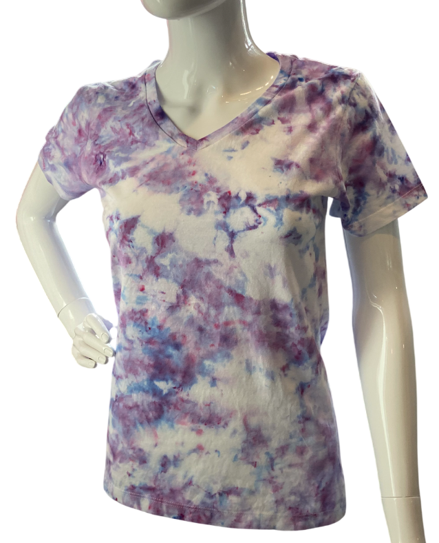 Mannequin wearing a tie-dye shirt with purple and blue patterns on a white background