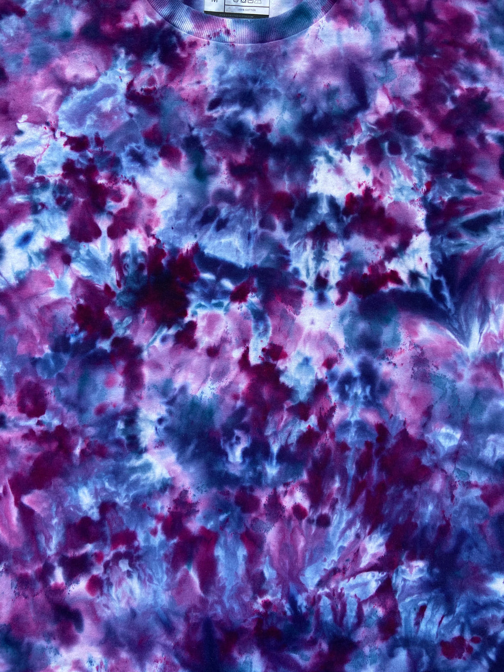 Abstract tie-dye pattern in purple and blue