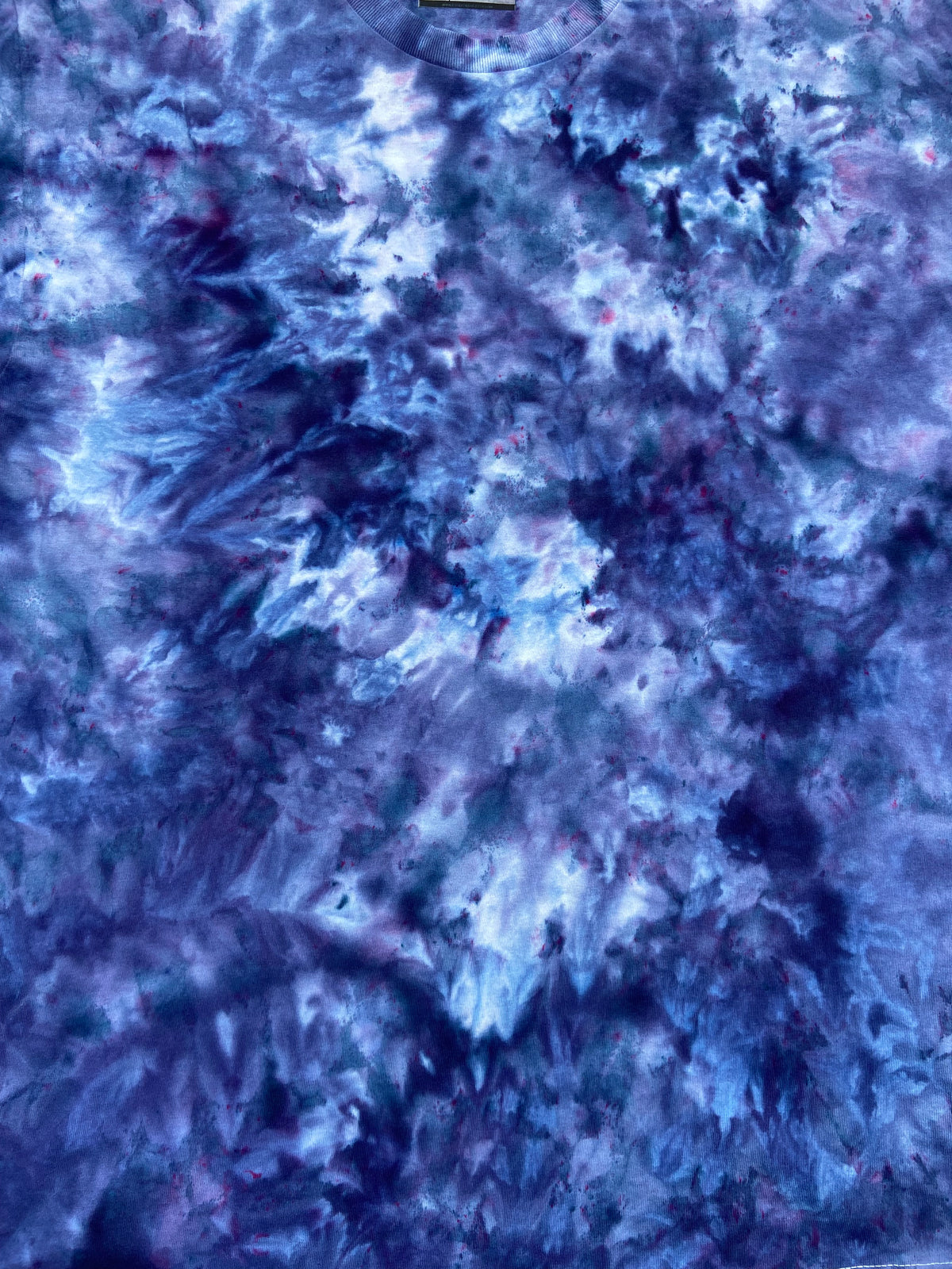 Close-up of Midnight Blue Ice Scrunch tie-dye fabric featuring deep navy, indigo and pale blue organic patterns.