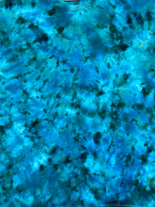 Close-up of blue and green marbled Tie Dye Tshirt