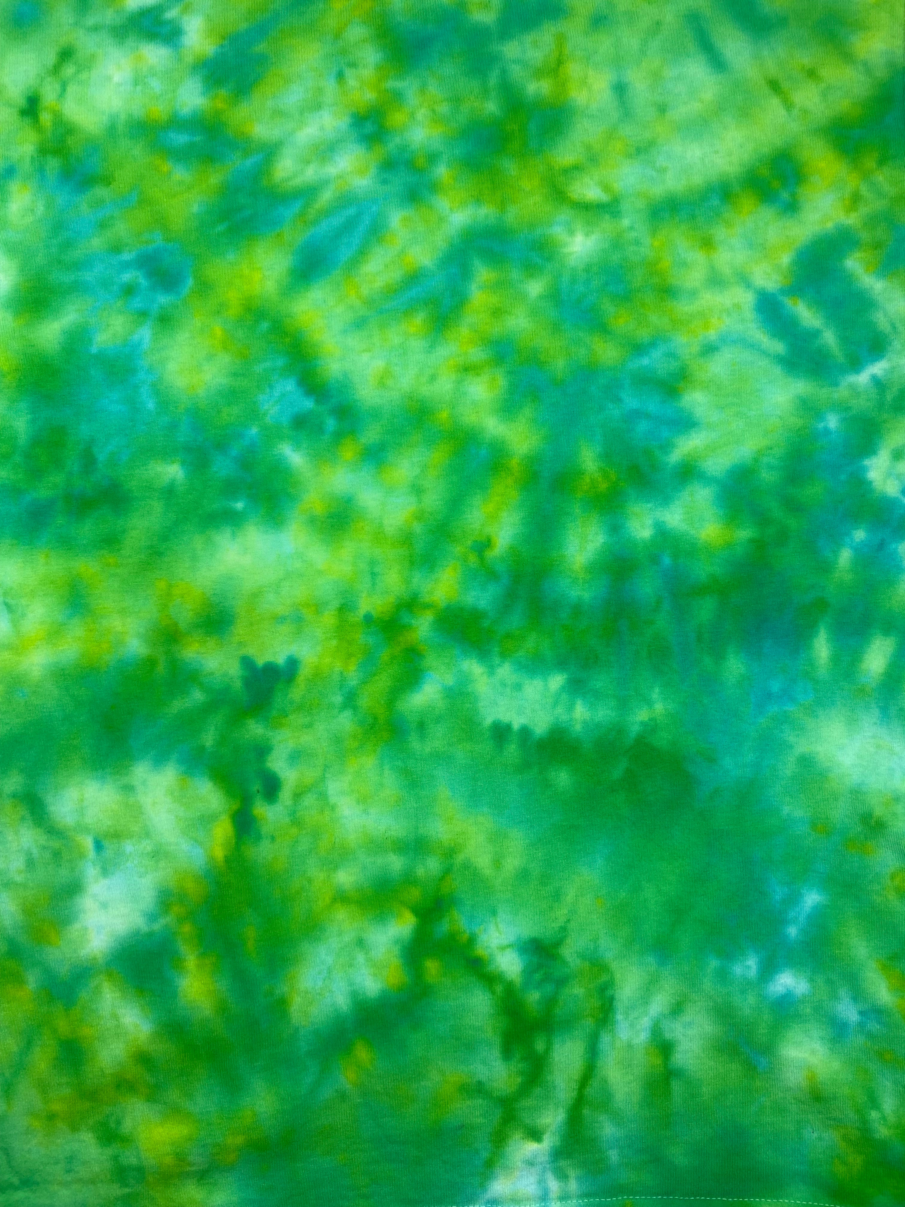 Mottled green and blue patterned fabric texture