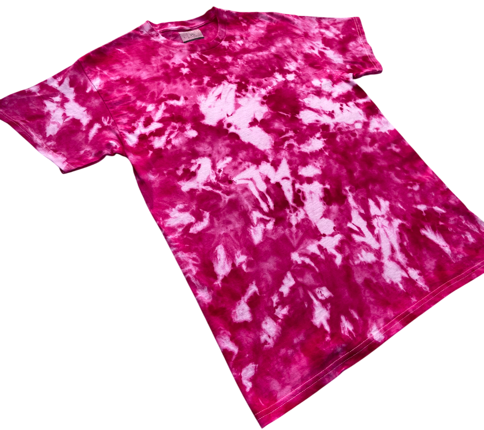 Angled view of the Fuchsia Red Ice Scrunch tie dye T-shirt in vivid fuchsia, deep pink and white, showing the bold hand dyed scrunch pattern on a white background.