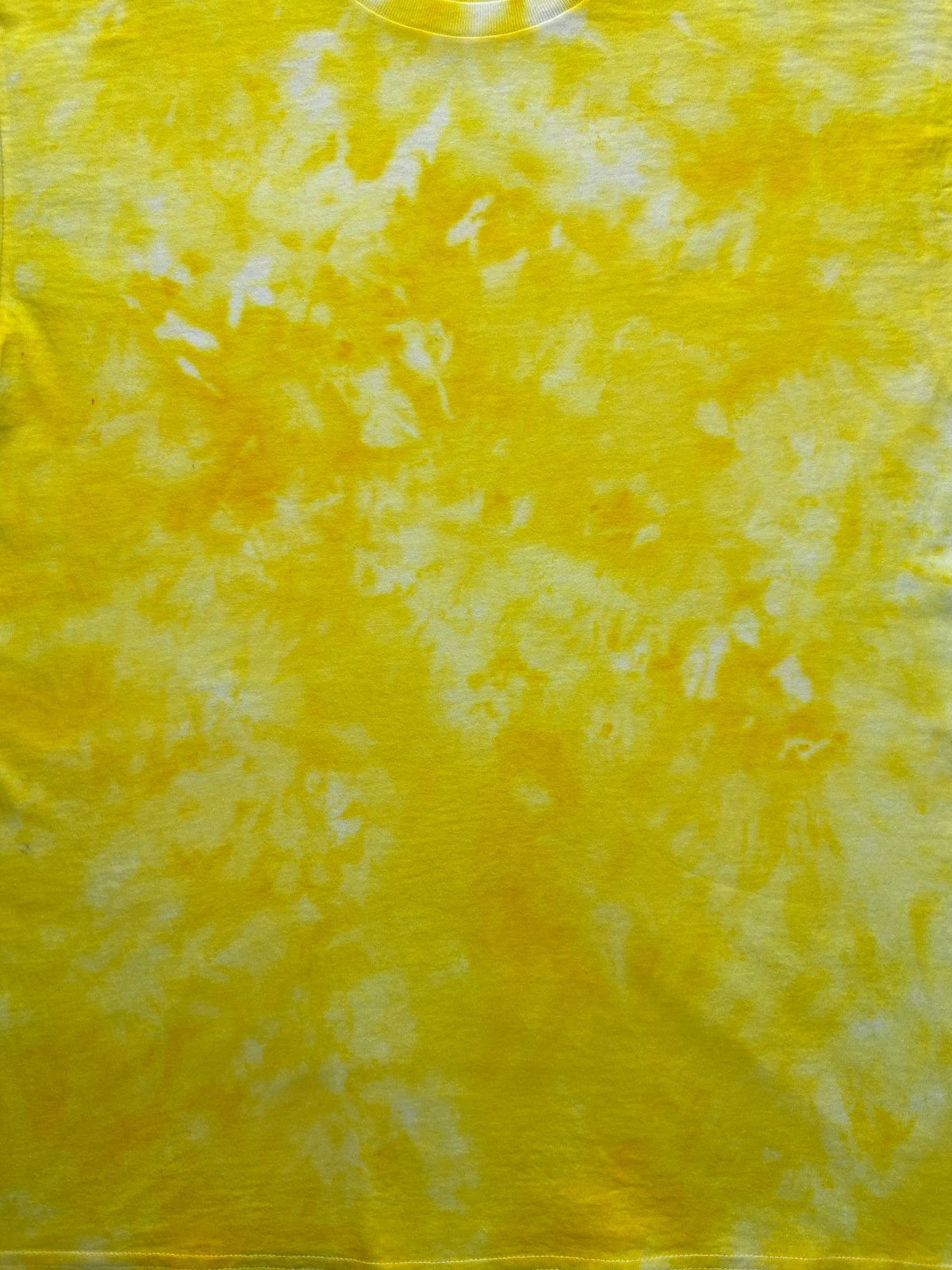 Close-up of the Lemon Yellow Ice Scrunch tie dye pattern in bright lemon yellow and white, showing the hand dyed fabric detail.