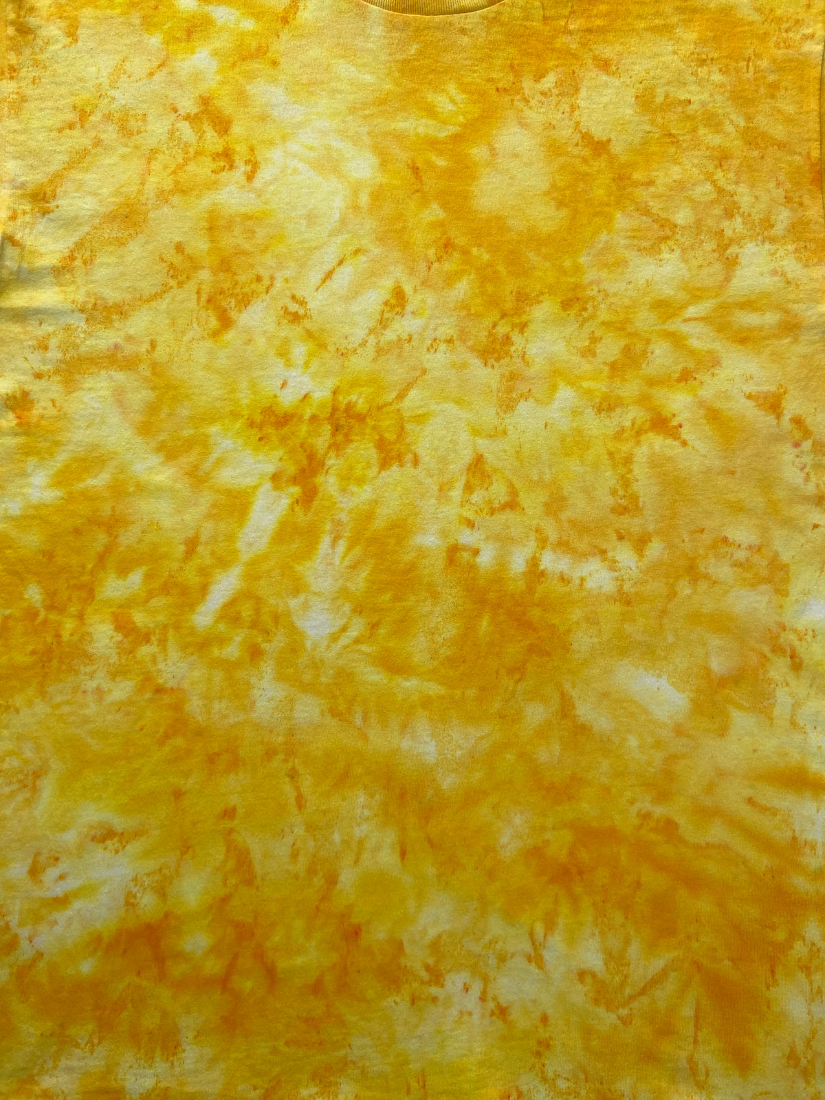 Close-up of the Daffodil Ice Scrunch tie dye pattern in golden yellow, bright yellow and white, showing the hand dyed fabric detail.