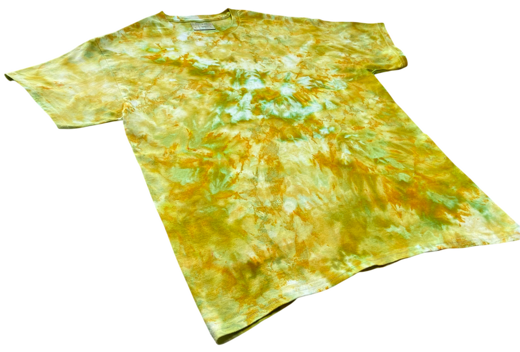 Chartreuse Ice Scrunch tie dye T-shirt shown at an angle, featuring mixed chartreuse, yellow-green and soft aqua tones.