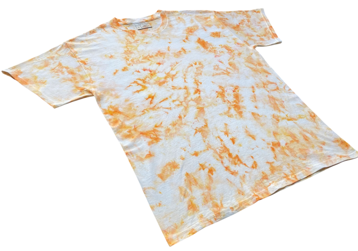 Ivory Ice Scrunch tie dye T-shirt in soft ivory and orange with a subtle hand dyed scrunch pattern on a white background.
