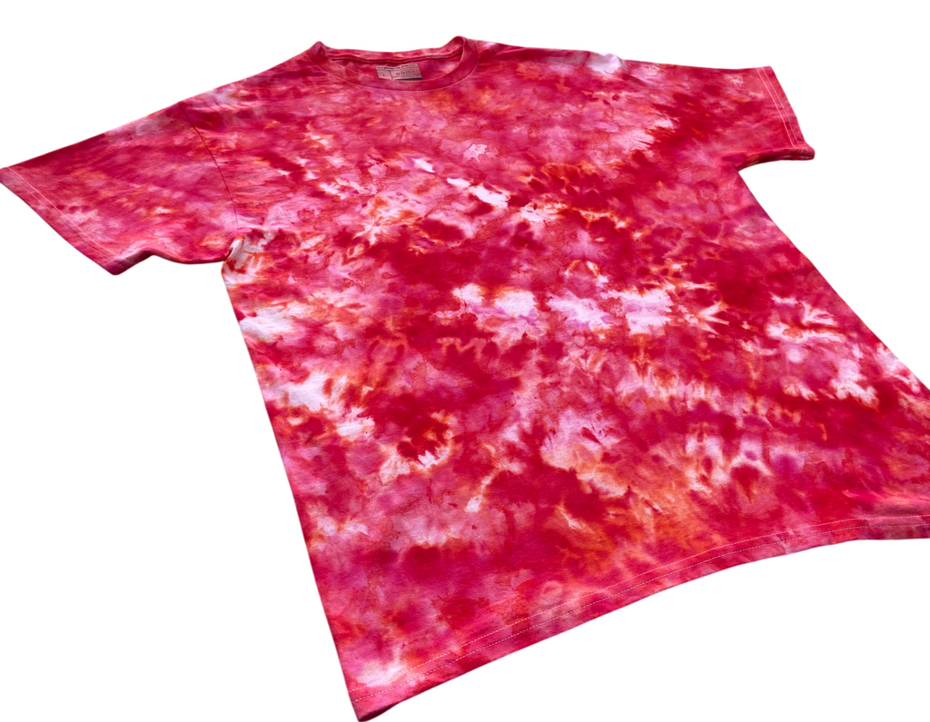 A short-sleeve crewneck tie-dye t-shirt featuring a vibrant red, pink, and white spiral pattern, shown flat against a plain white background.