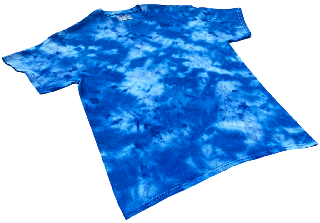 A short-sleeve crewneck t-shirt featuring a vibrant blue and white tie-dye pattern, displayed flat against a solid white background.