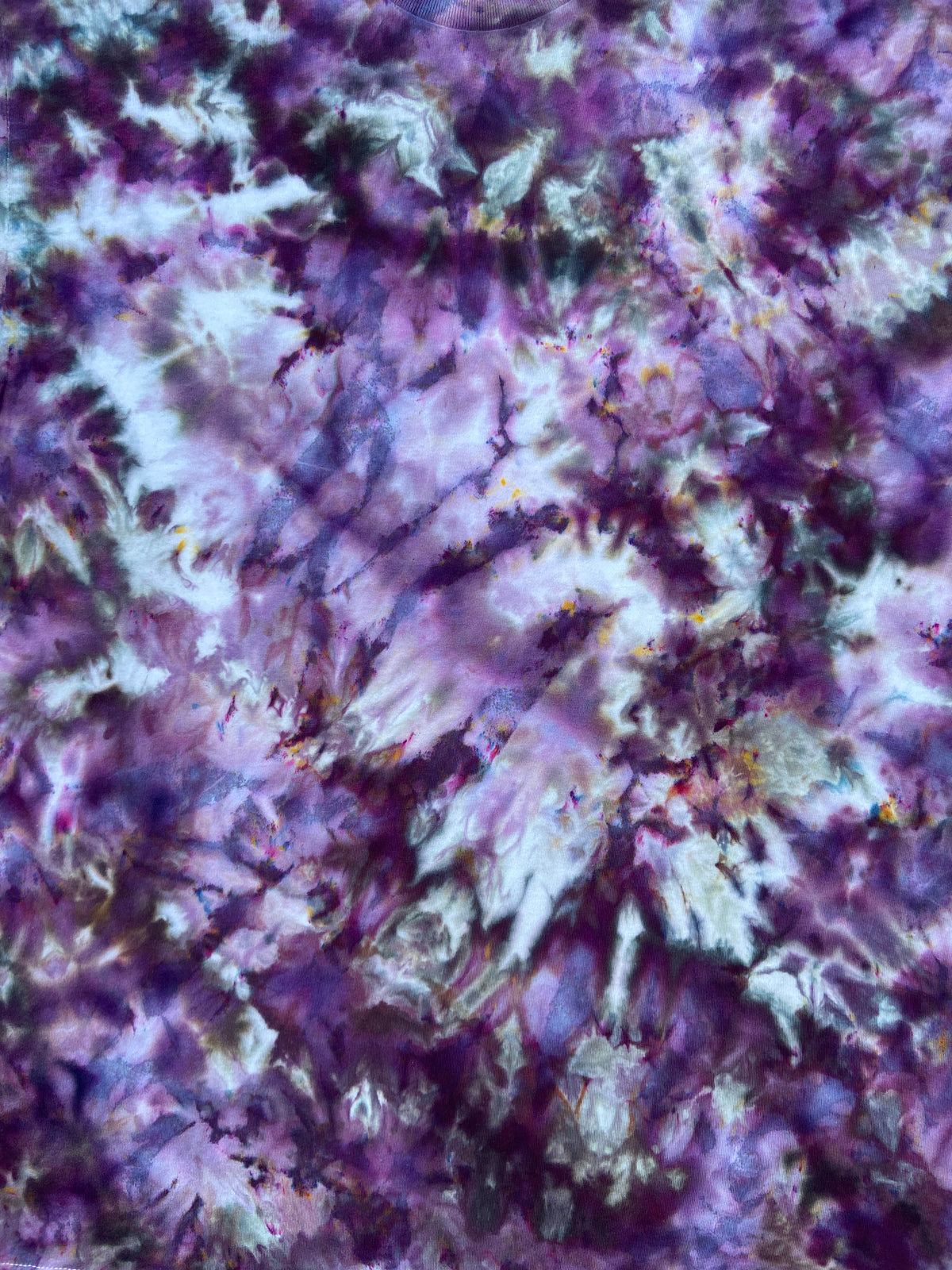 Close-up of Deep Purple Ice Scrunch tie dye fabric in purple, lilac, black and pale blue tones, individually hand dyed in the UK.