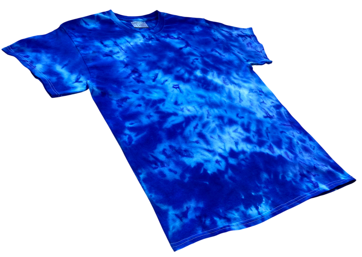 Stratosphere Ice Scrunch tie dye T-shirt shown at an angle, featuring vivid cobalt blue, electric blue and lighter icy blue hand-dyed patterns.