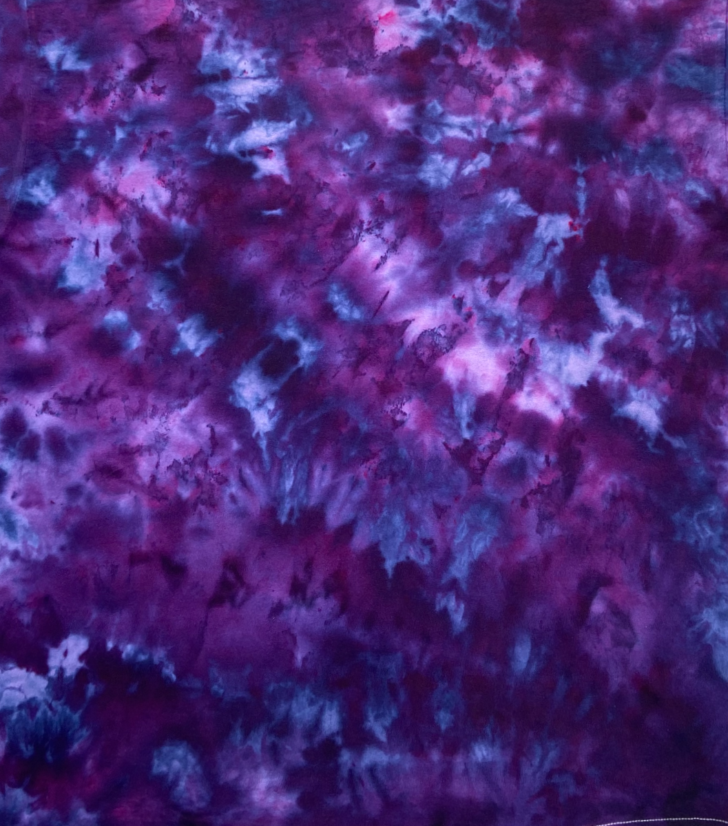 Close-up of Imperial Purple Ice Scrunch tie dye fabric showing rich purple, violet, pink and blue colour blending and organic ice-dye patterning.