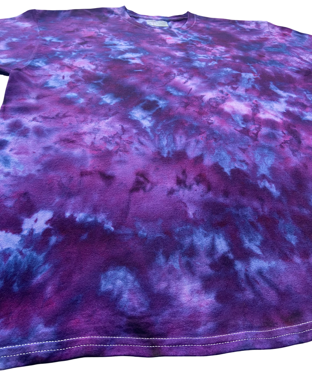 Close-up angled view of Imperial Purple Ice Scrunch tie dye T-shirt in deep purple, violet, magenta and blue tones, individually hand dyed in the UK.