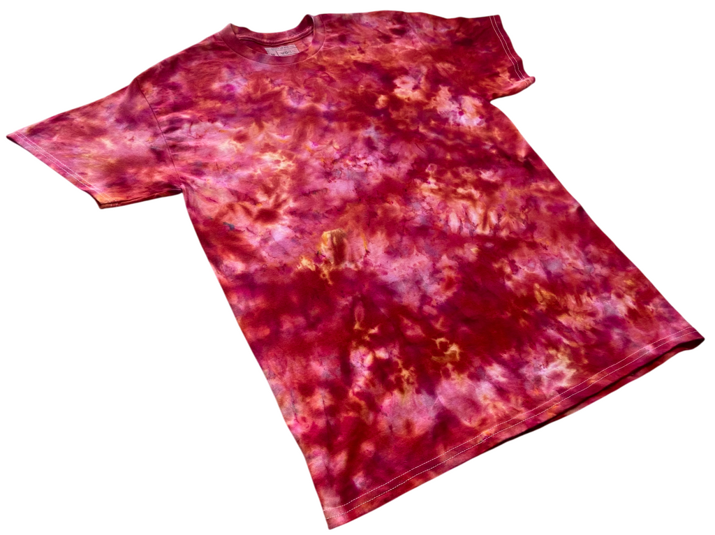 A short-sleeve tie-dye t-shirt with a marbled pattern of red, pink, and orange, shown flat against a white background.