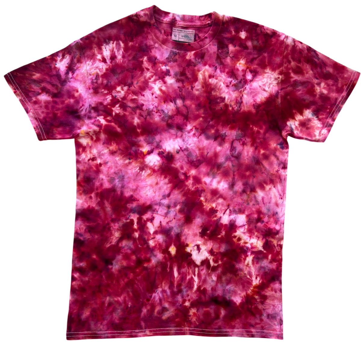 A short-sleeve crewneck t-shirt featuring a vibrant magenta and pink tie-dye pattern with splashes of purple and deep red, displayed flat against a solid white background.