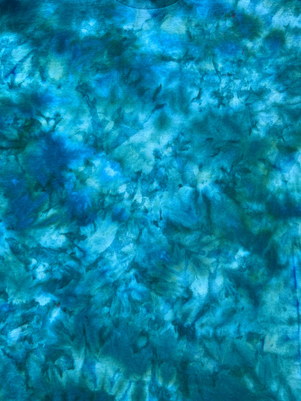 Close-up of Kingfisher Blue ice scrunch tie-dye fabric featuring rich turquoise, teal, aqua blue and darker blue-green tones.