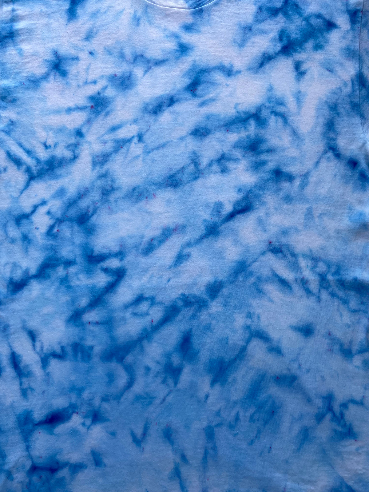 Close-up of Baby Blue Ice Scrunch tie dye fabric in soft sky blue and white tones, individually hand dyed in the UK.