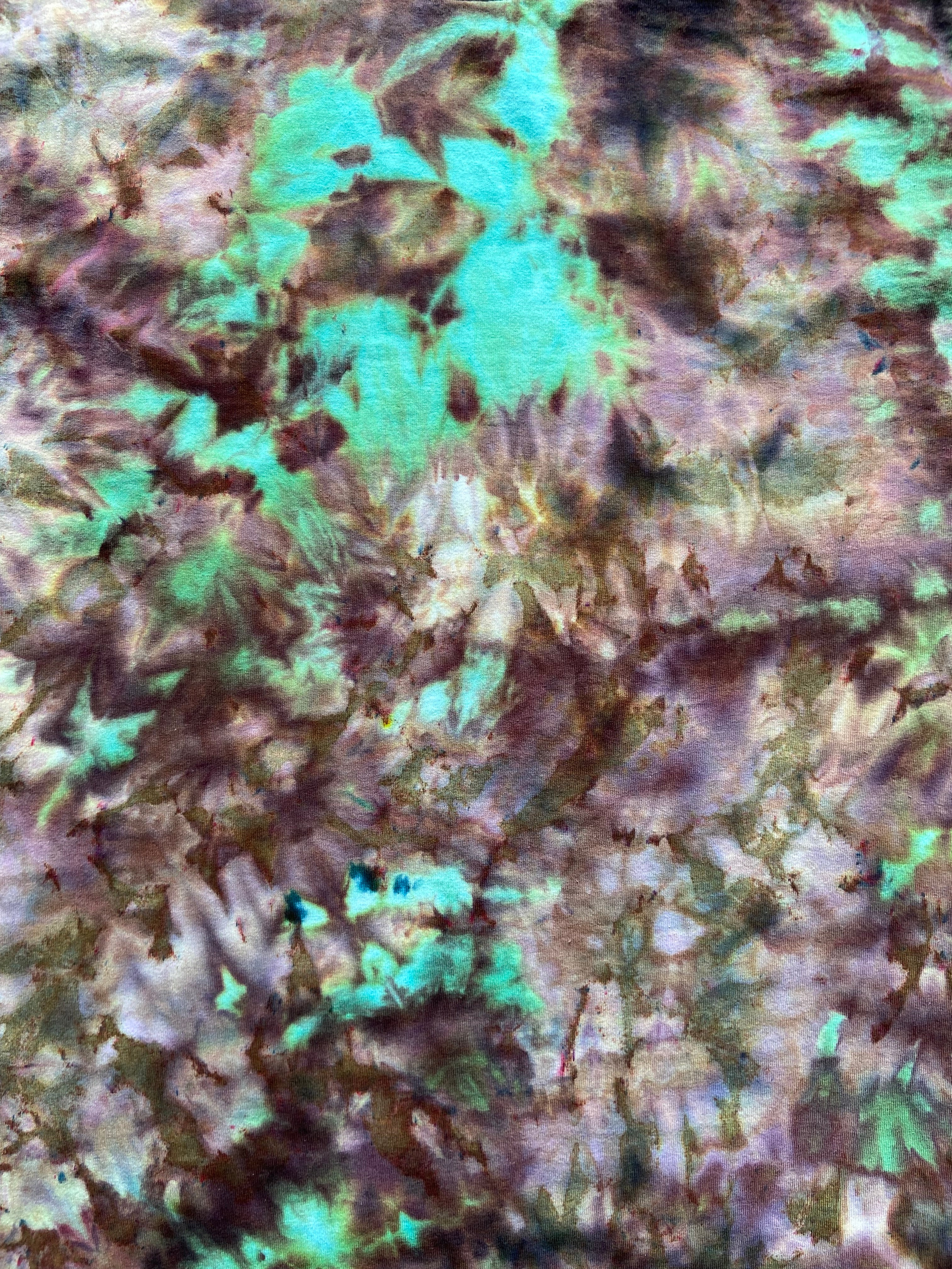 Close-up of a textured surface with green and brown colors