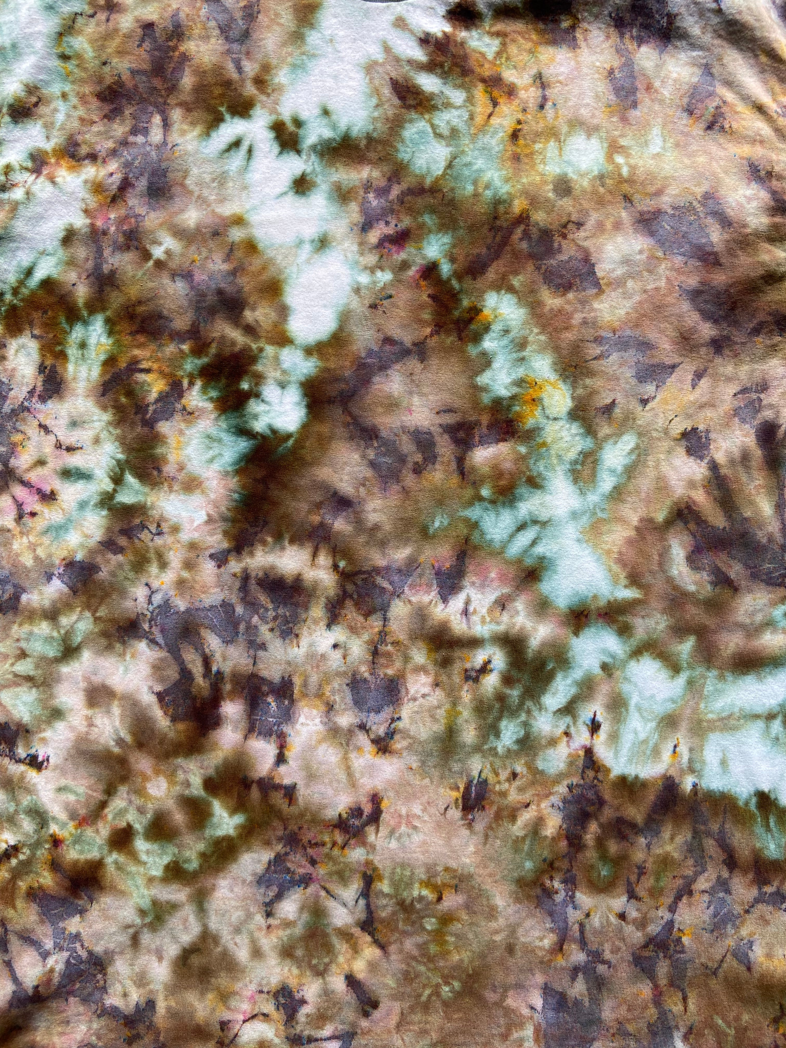 Close-up of a textured fabric with earthy tones and patterns