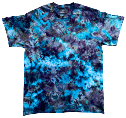 The Alchemist Ice Scrunch tie dye T-shirt featuring vibrant turquoise blue, teal, deep purple and black tones in a striking marbled ice dye pattern.