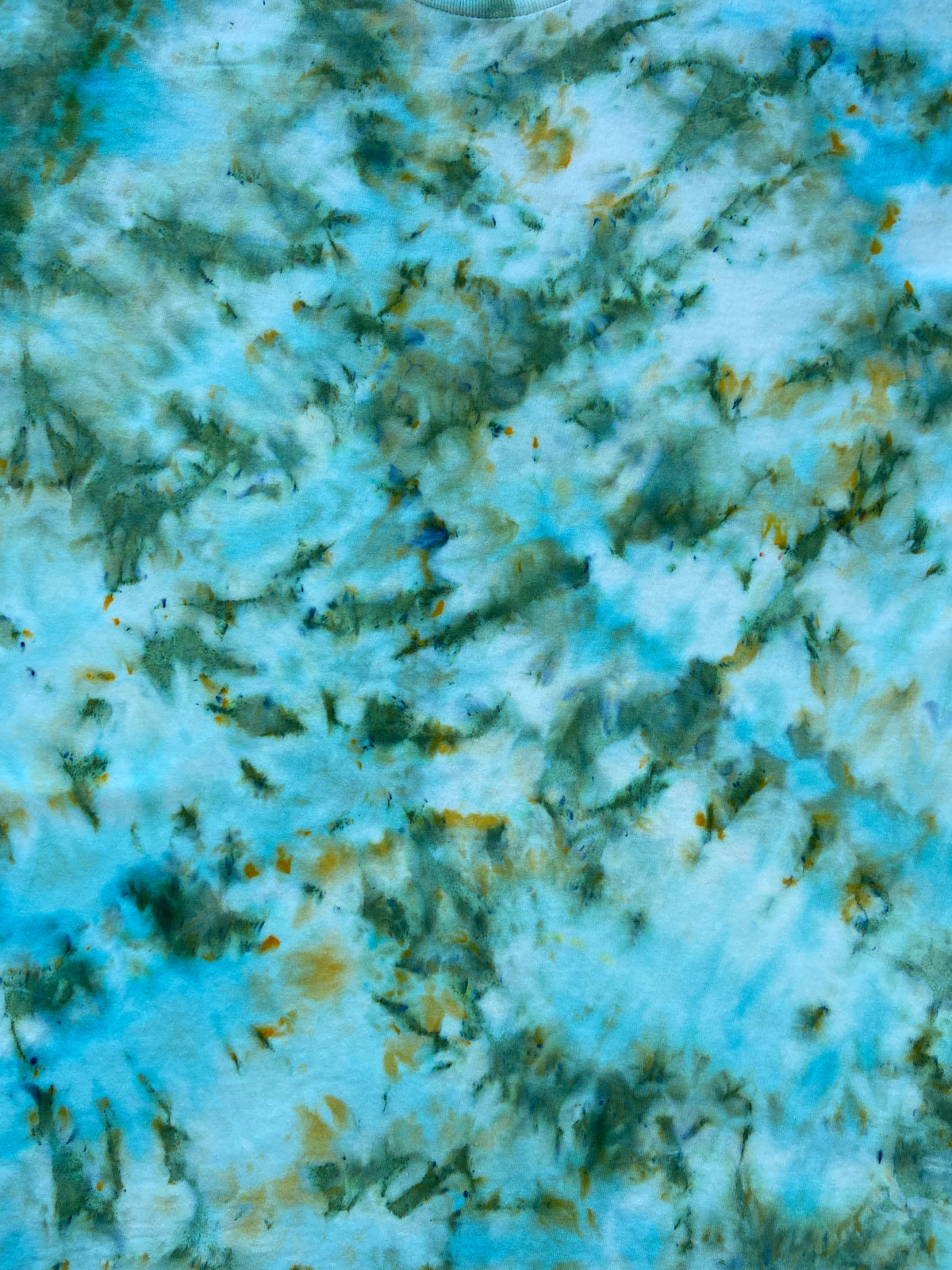 Close-up of Sea Glass Ice Scrunch tie dye fabric showing delicate aqua, sea green and golden tones with intricate ice dye detailing.