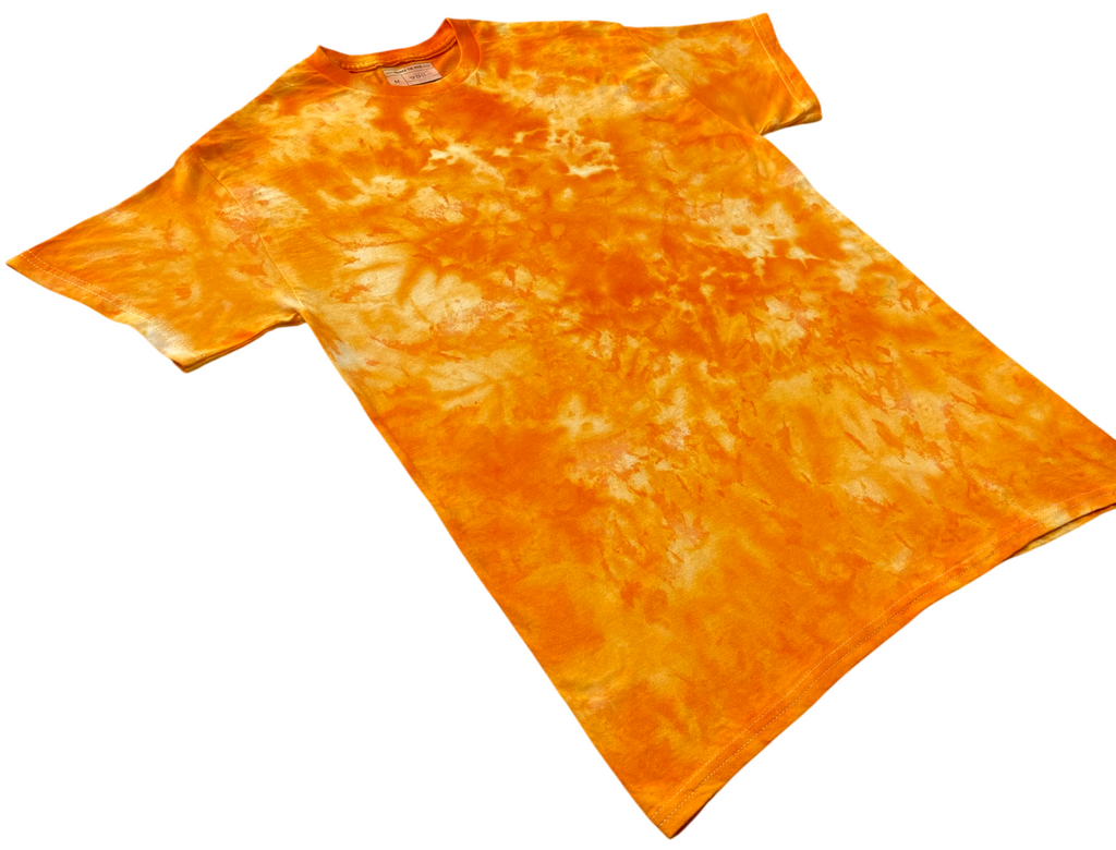 Angled view of the Deep Yellow Ice Scrunch tie dye T-shirt in rich golden yellow and orange with lighter cream areas, showing the hand dyed scrunch pattern on a white background.