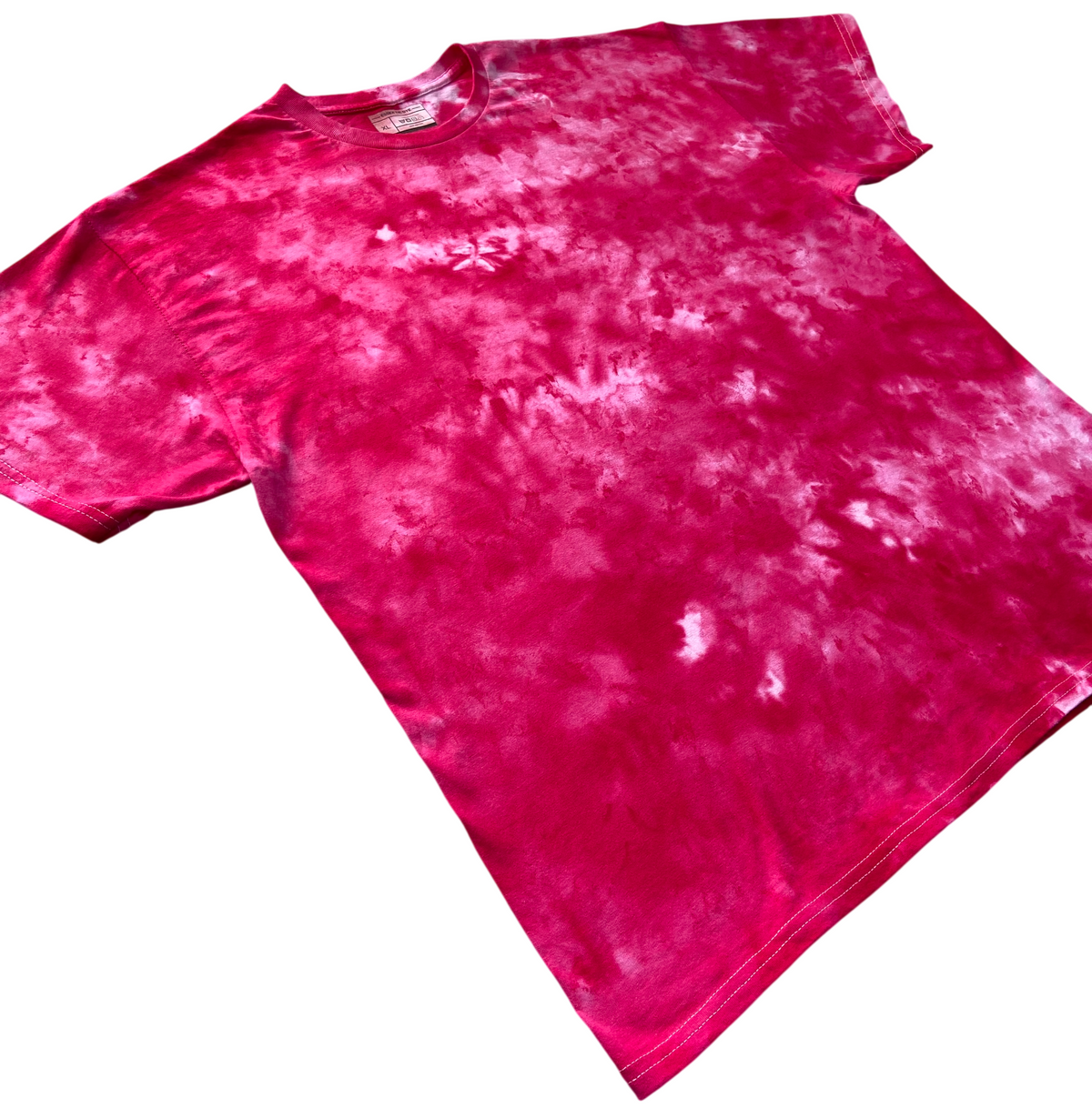 Angled view of the Light Red Ice Scrunch tie dye T-shirt in vivid pink-red and pale pink, showing the hand dyed scrunch pattern on a white background.