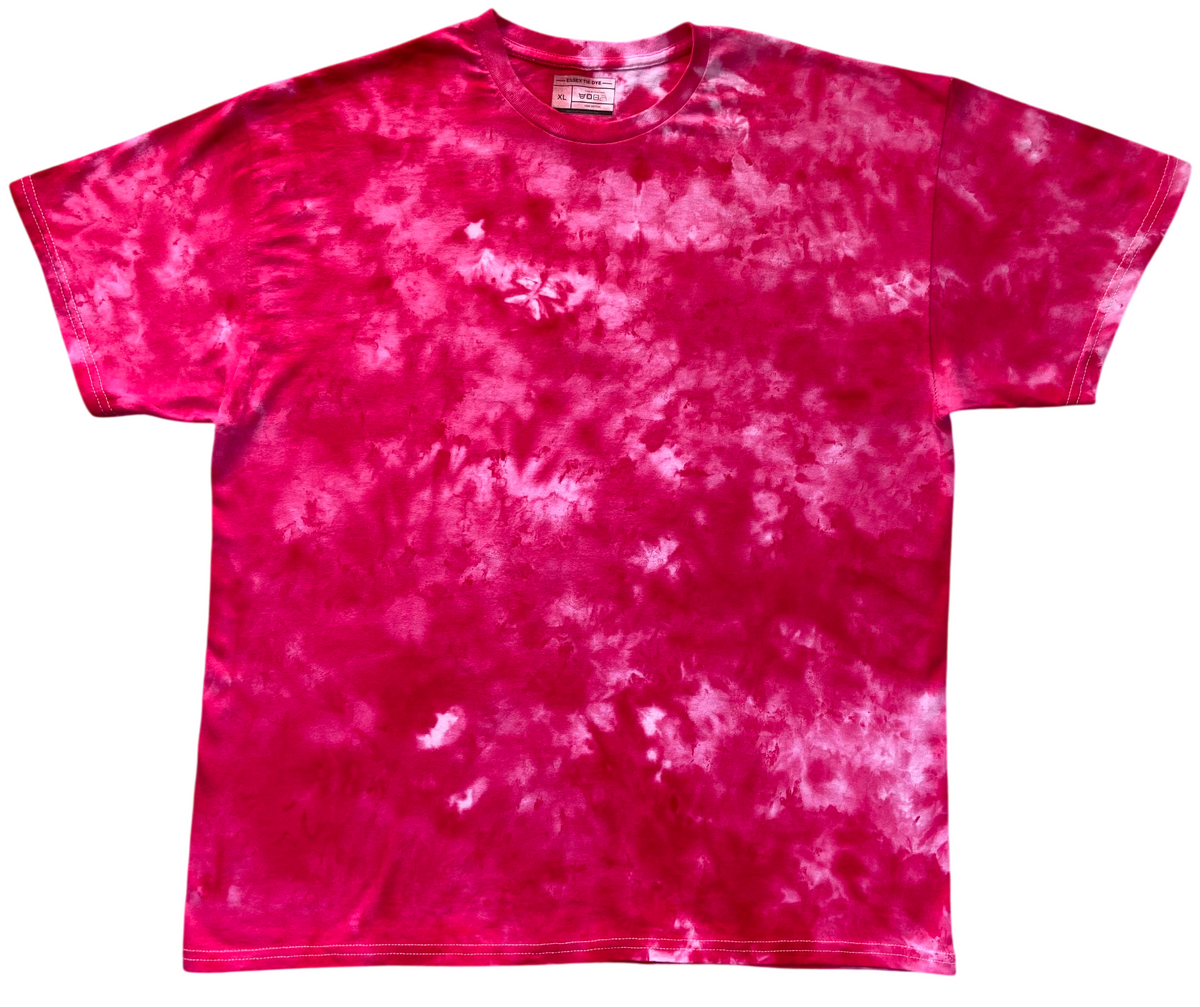 Light red ice scrunch tie dye T-shirt laid flat, featuring rich pink-red tones with soft pale pink and white cloudy patterns throughout.