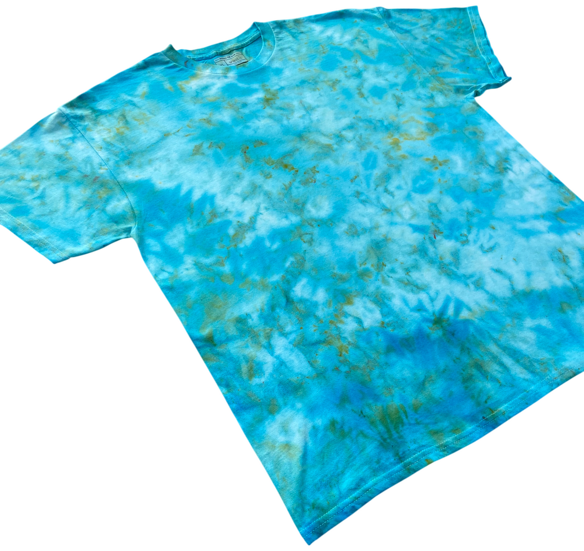Parakeet Ice Scrunch tie-dye T-shirt shown at an angle, featuring bright turquoise and aqua tones with soft green detailing.