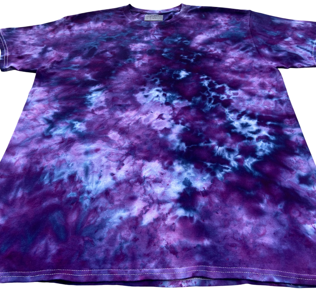 Close-up of Power Berry Ice Scrunch tie dye fabric in deep purple, berry, violet and blue tones, individually hand dyed in the UK.
